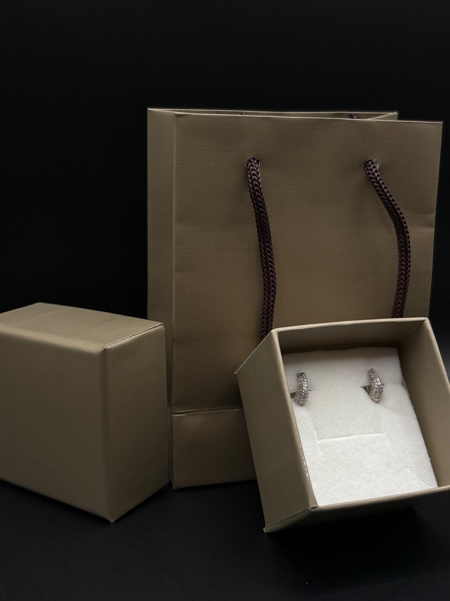 Delicate hoop earrings made of 925 sterling silver with white zircons